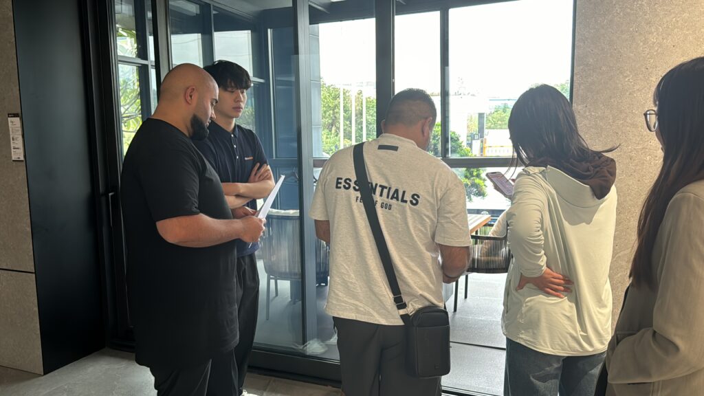 foreign customers visiting aluminum window showroom